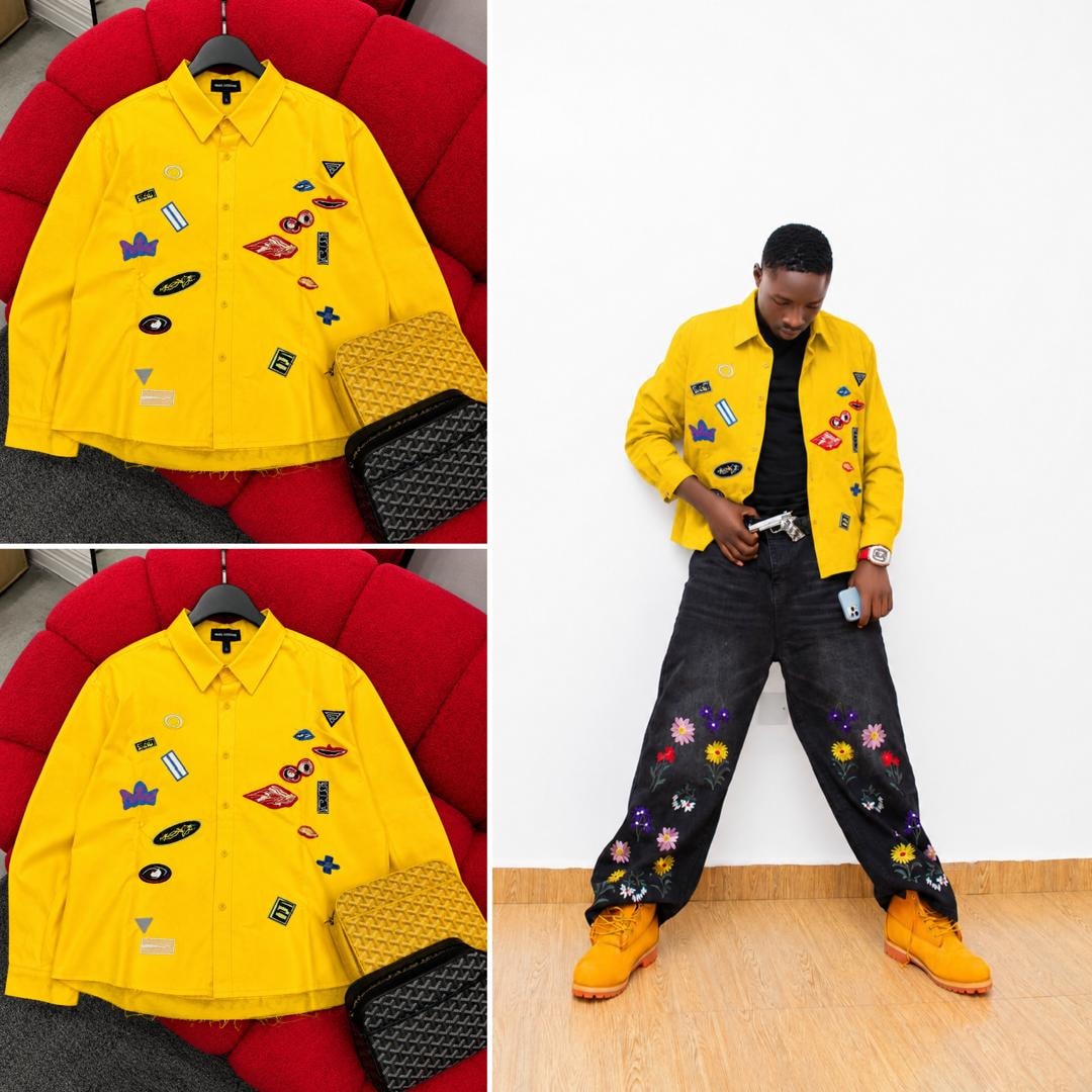 Yellow Marc Lewis patch shirt on red couch and modeled with embroidered pants.