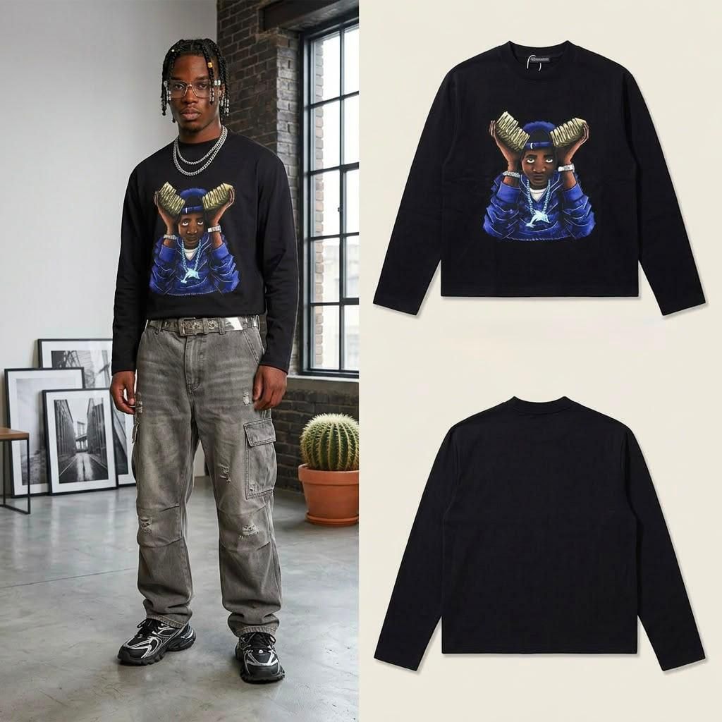 Man standing in black cropped long sleeve money portrait graphic top with front and back flats.