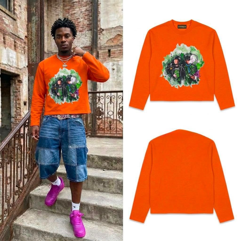 Orange long sleeve sweatshirt with two figures graphic on model and in flat lays.