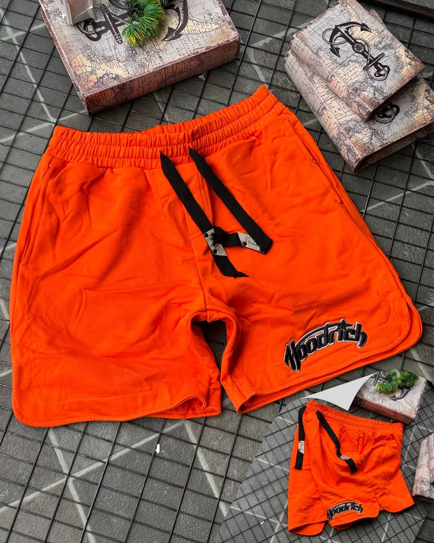 Orange Hoodrich fleece shorts with black ties and leg logo.