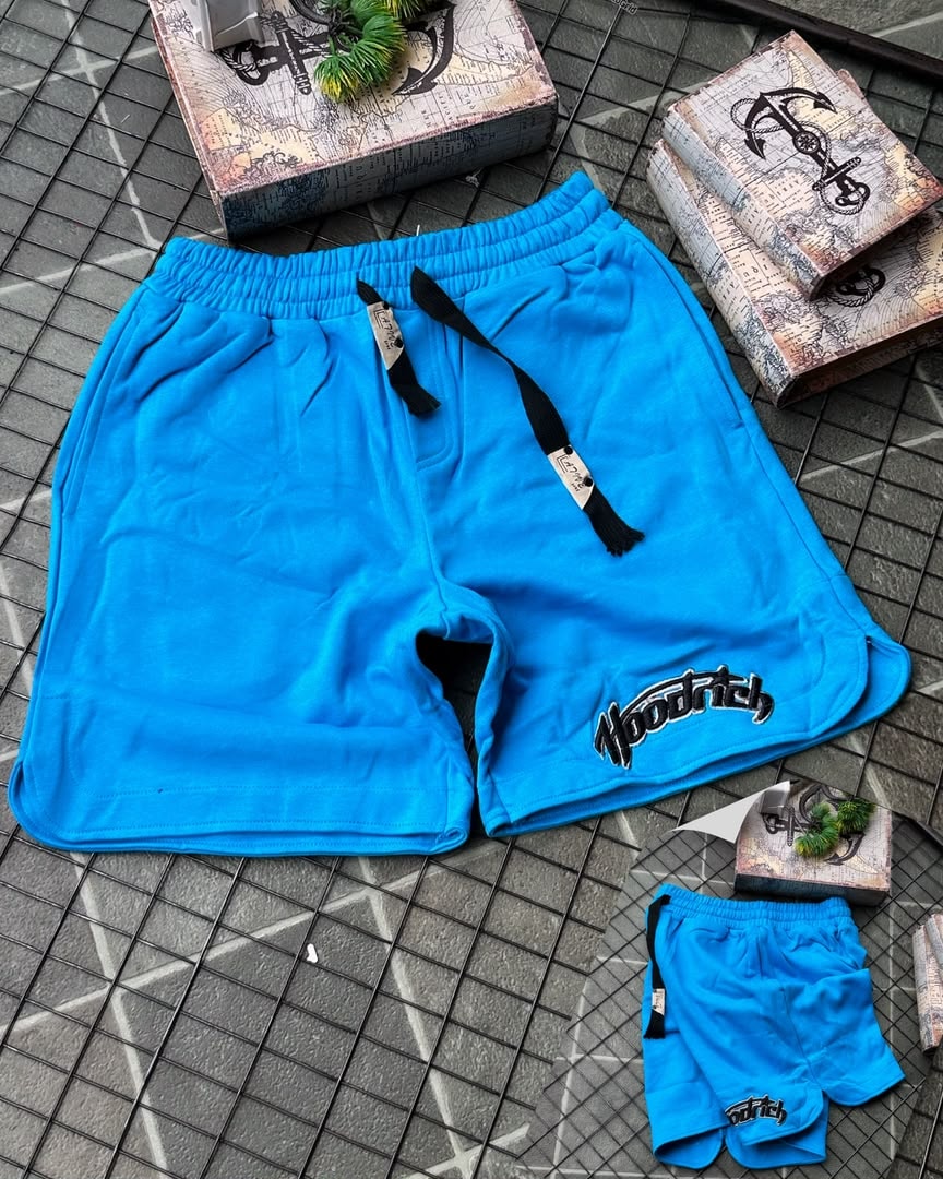 Bright blue Hoodrich fleece shorts with drawstring and leg embroidery, shown with smaller pair.
