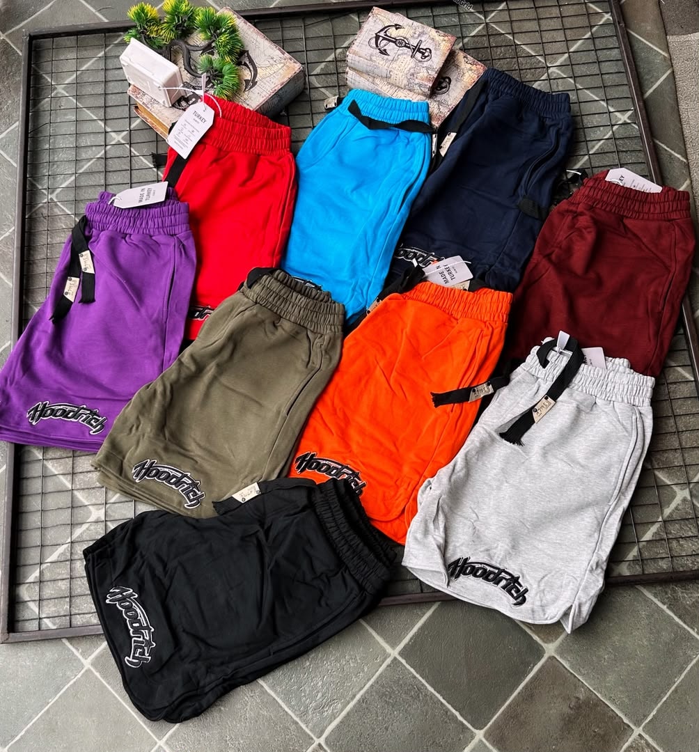 Group of Hoodrich fleece shorts in 9 colors including purple, red, blue, navy, burgundy, olive, orange, black and gray.