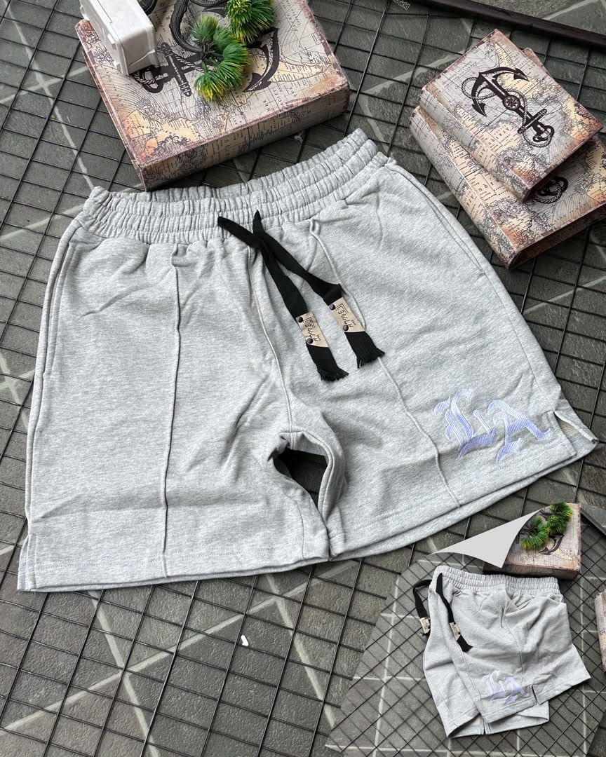 Gray LA embroidered fleece shorts with light logo and drawstring.