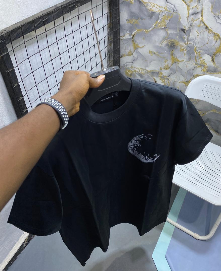 Black t-shirt with white abstract graphic on the chest.