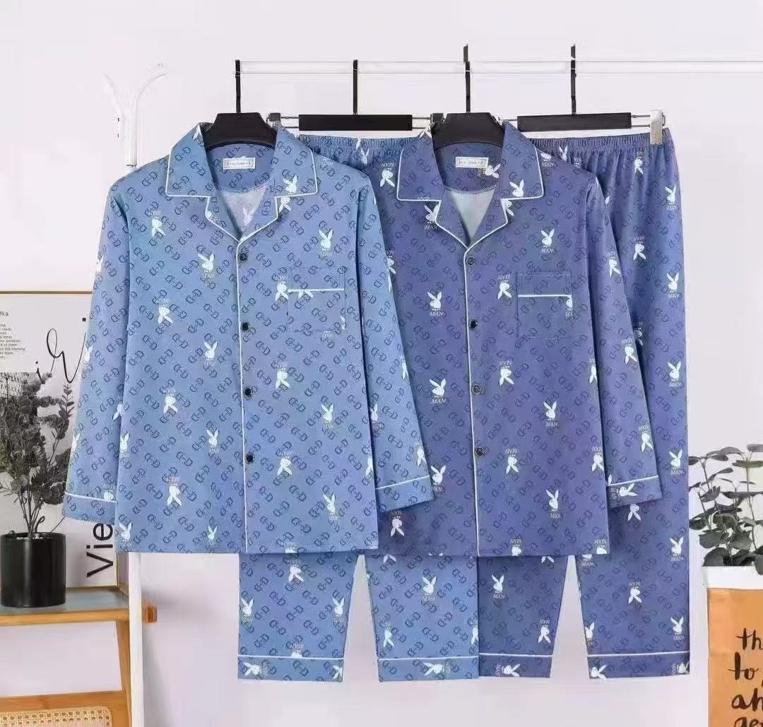 Unisex flannel pajama set with bunny and monogram print shown in two blue shades side by side.