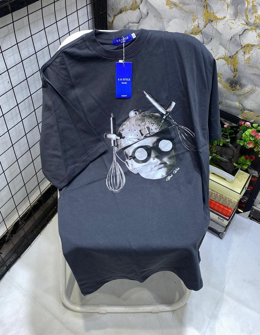 Dark gray t-shirt displaying chef portrait graphic composed of kitchen utensils.
