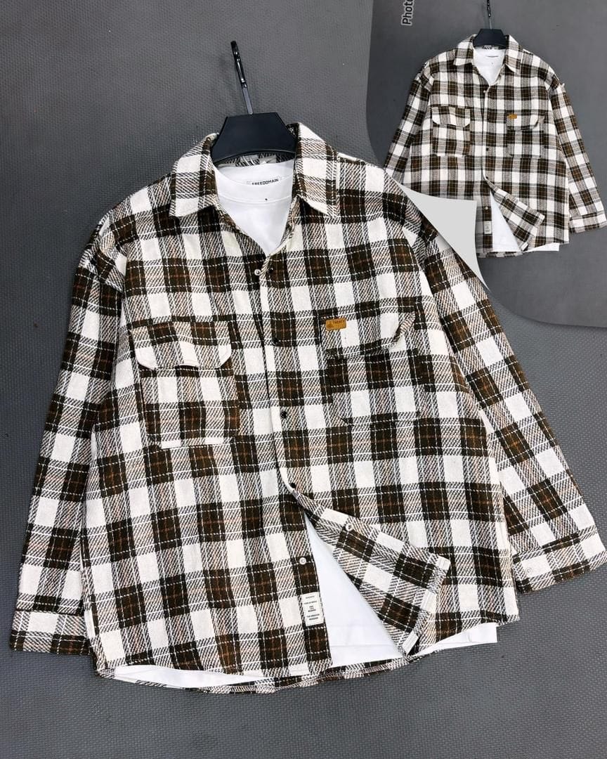 Brown and white plaid flannel button-down shirt shown on hanger with open front and inset back view.