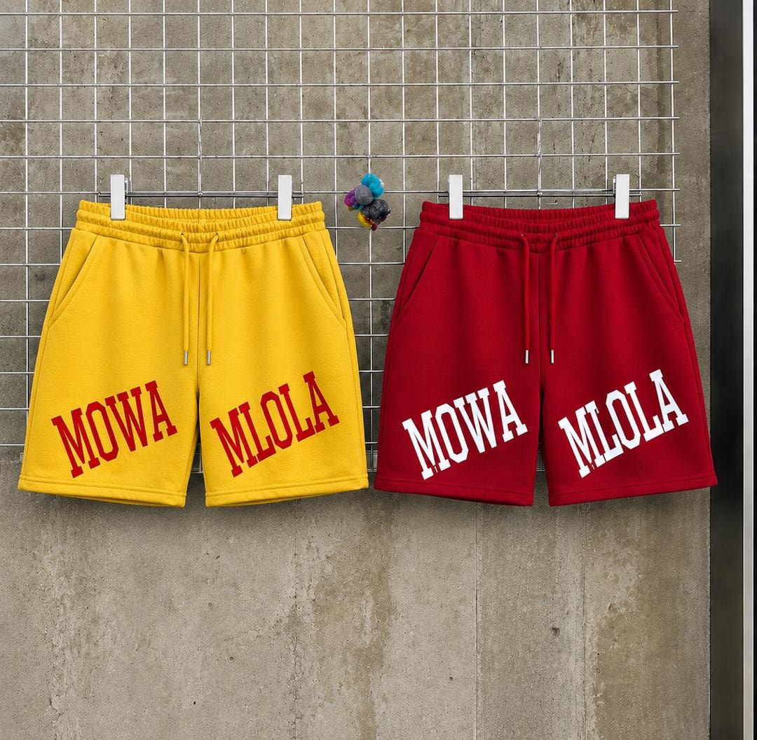 Yellow and red MOWA MLOLA printed fleece shorts hanging side by side.