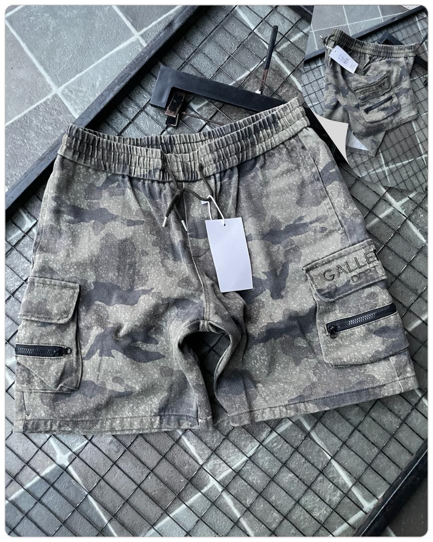 Flat lay of olive camo cargo shorts with drawstring, tag and back view.