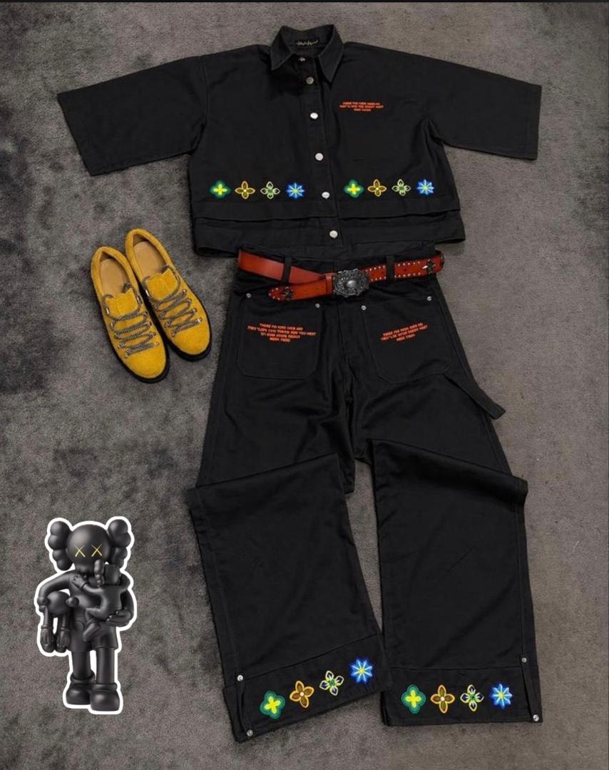 Black short-sleeve button-up shirt and cargo pants two-piece set with colorful floral embroidery and styling accessories.