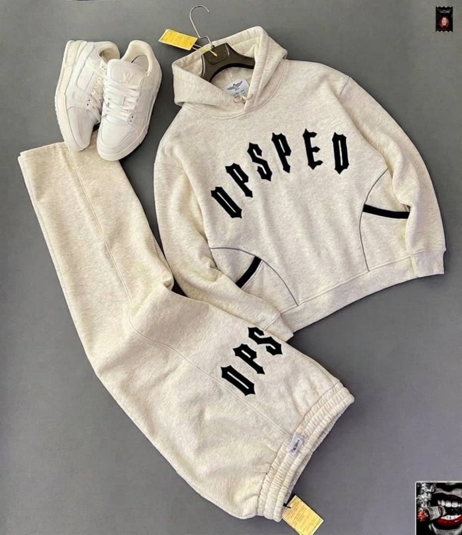 Cream UPSPED gothic hoodie and matching jogger pants with white sneakers.