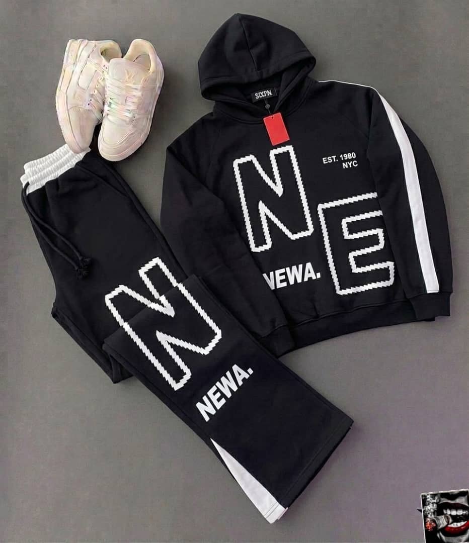Black NEWA pixel letter hoodie and matching jogger pants with iridescent sneakers.