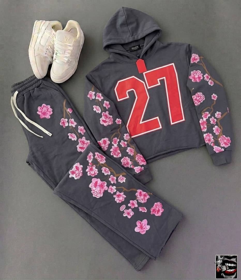Dark gray 27 cherry blossom printed hoodie and matching jogger pants with white sneakers.