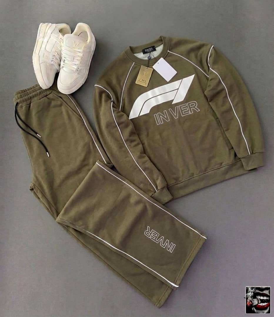 Olive green INVER graphic hoodie and matching jogger pants laid flat with white sneakers.