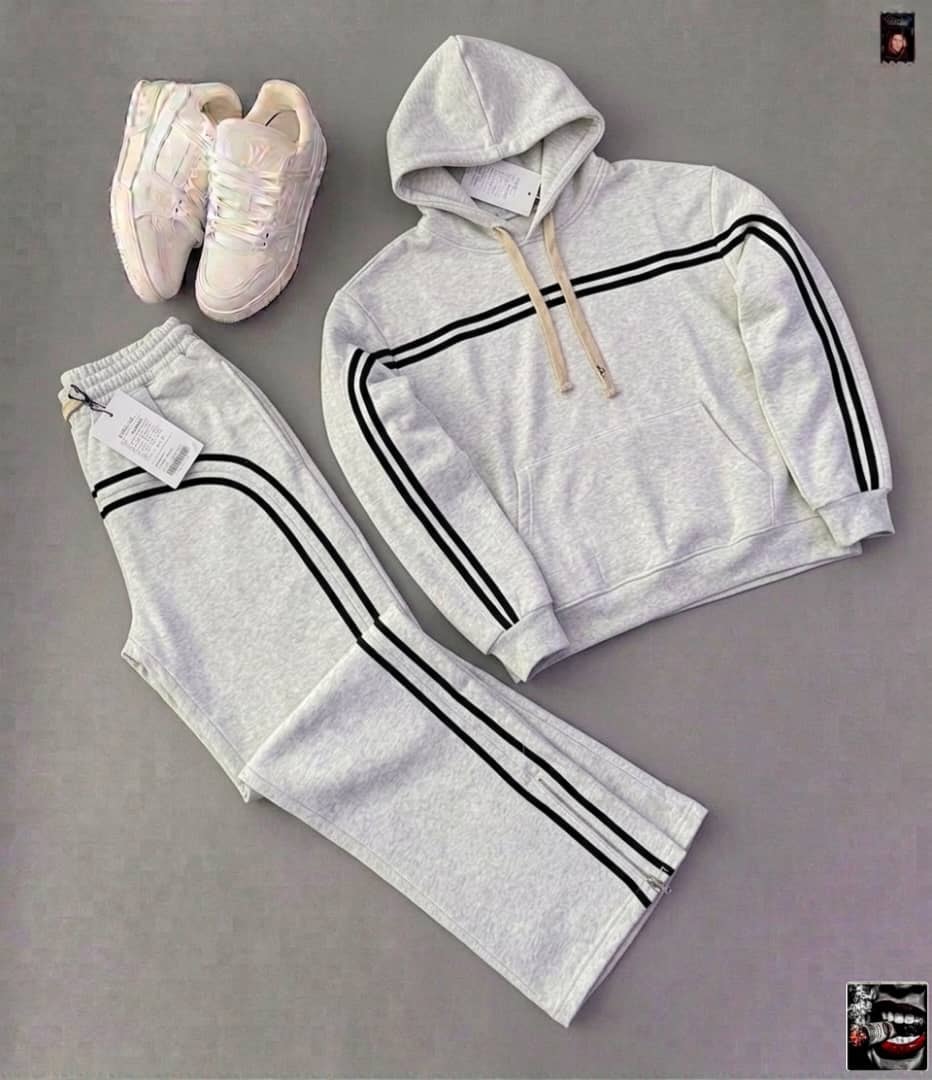 Light gray striped hoodie and jogger pants set with black stripes and white sneakers.