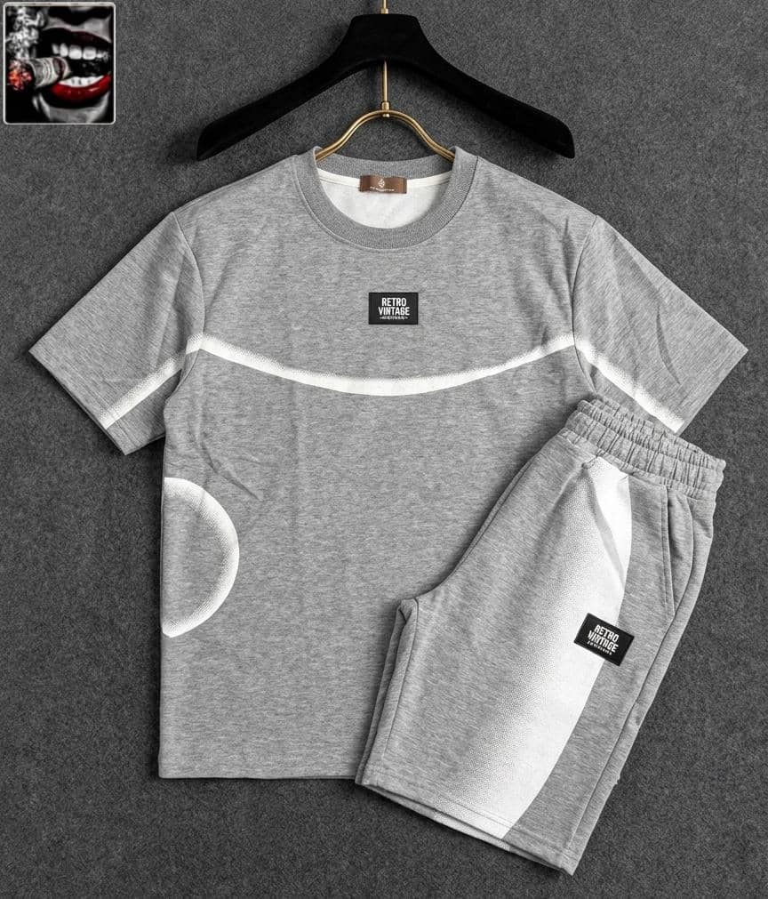 Gray RETRO VINTAGE two-piece set with white curved stripe and circle detail.