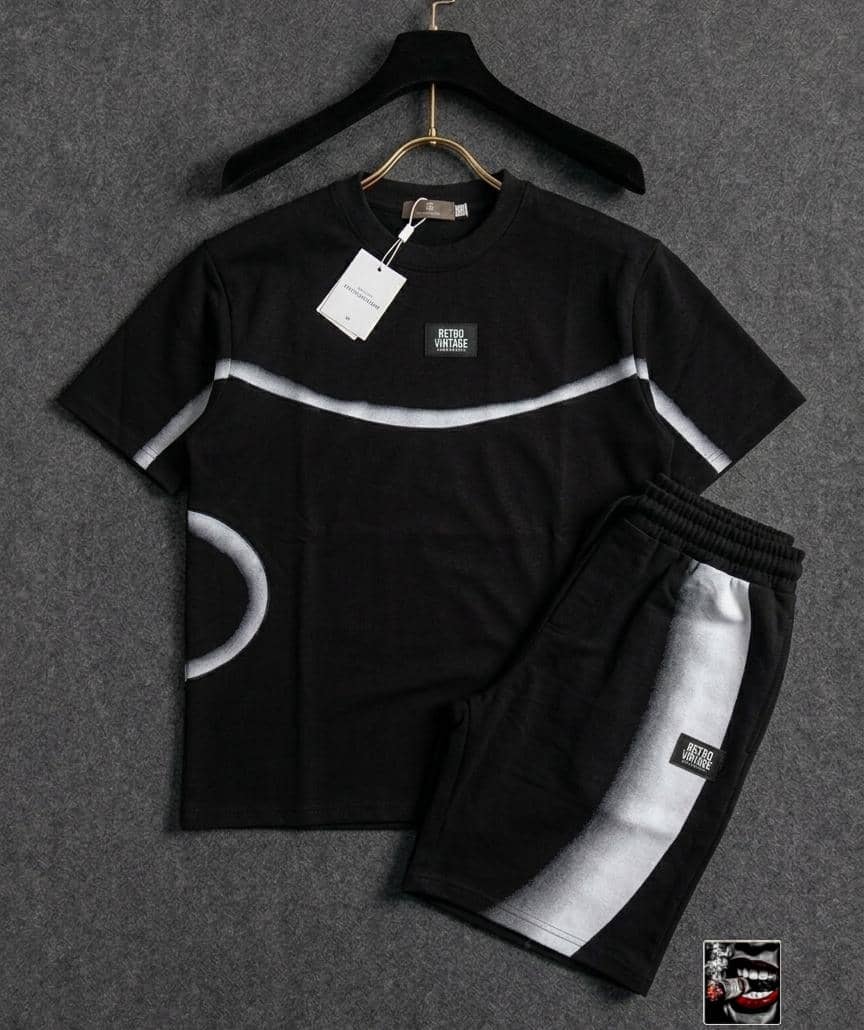 Black RETRO VINTAGE two-piece set with white curved stripe and circle detail.