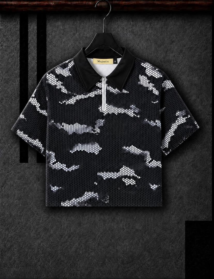 Black cropped camo polo shirt with black collar hanging on hanger.