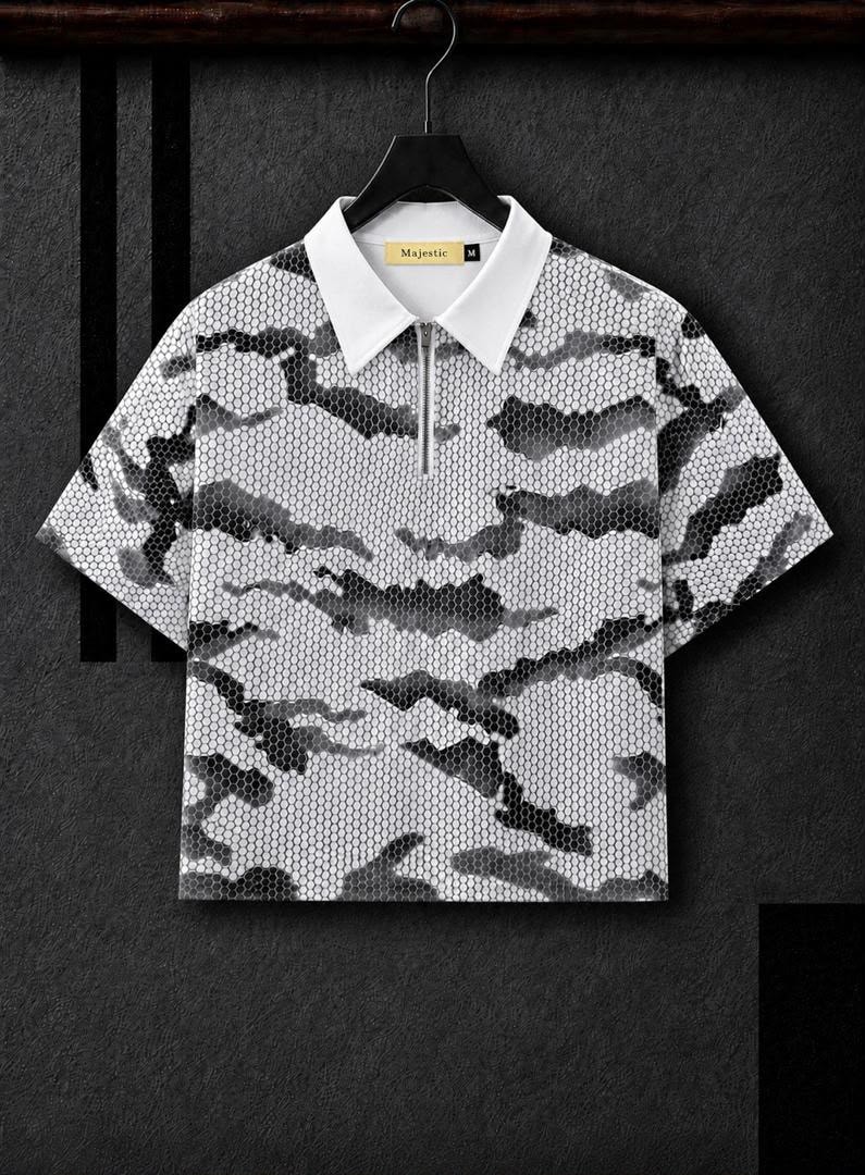 White cropped camo polo shirt with white collar hanging on hanger.