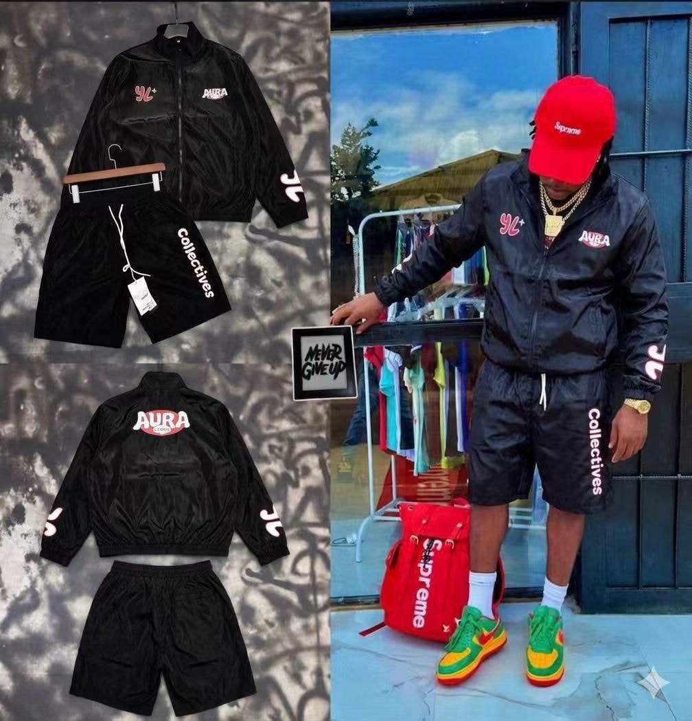 Black two-piece tracksuit displayed in flat lay views and worn by model.