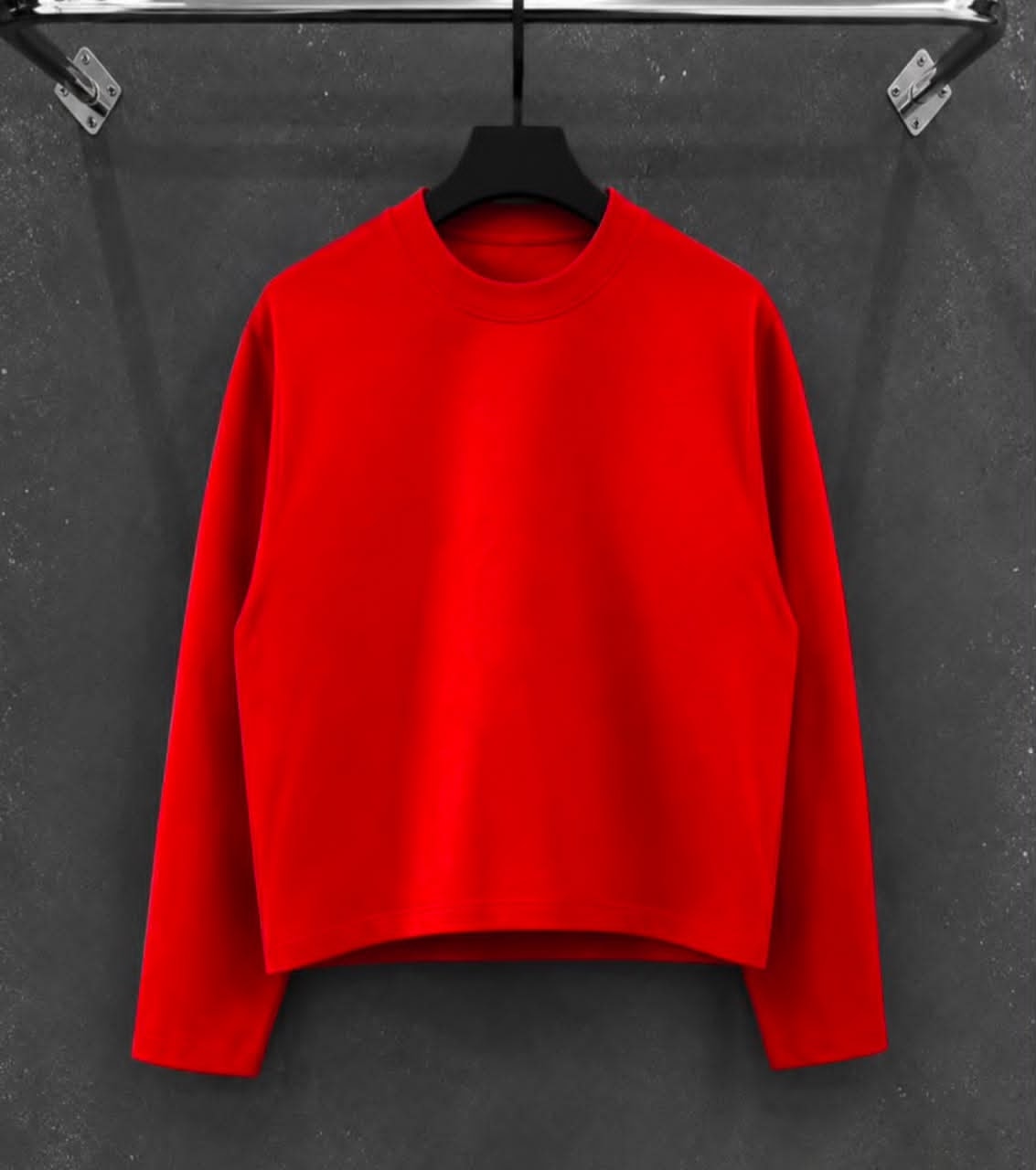 Red Hager cropped long-sleeve sweatshirt on black hanger against dark background.