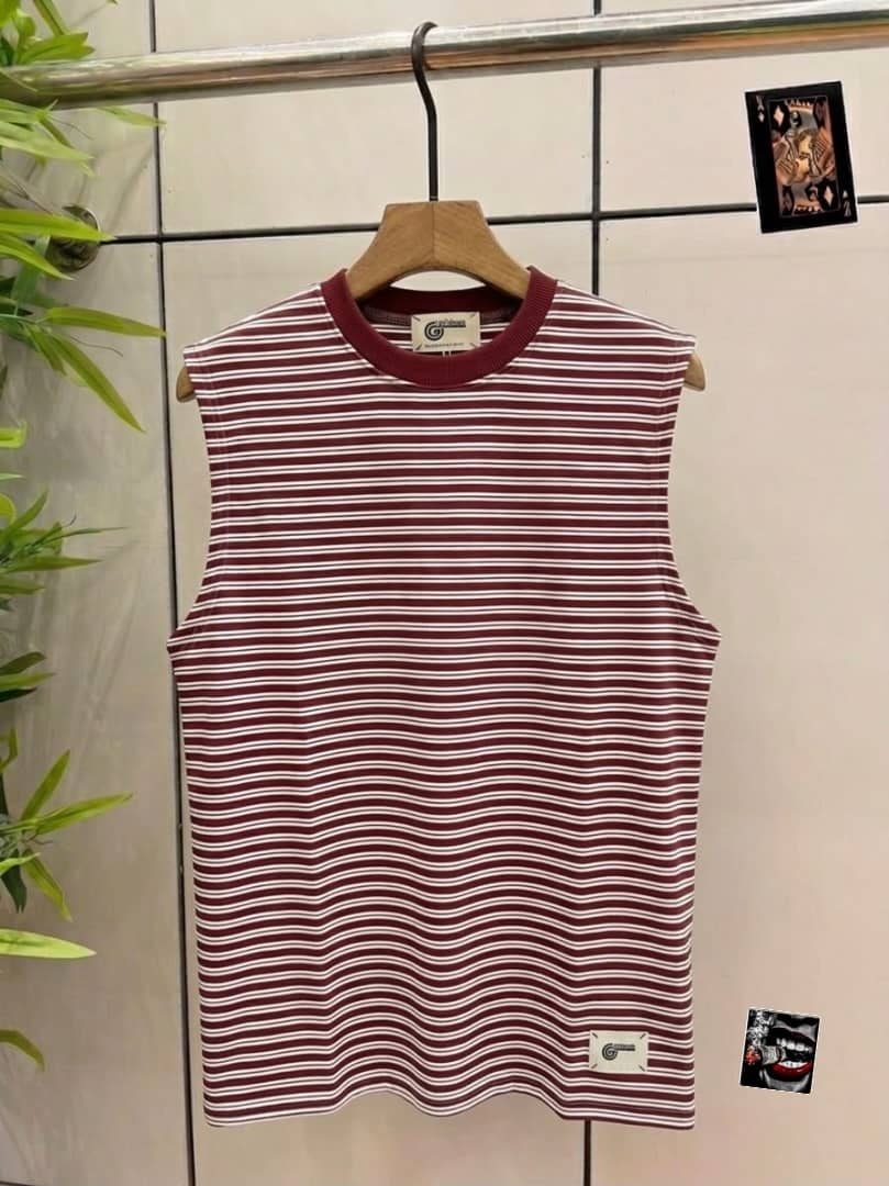 Maroon and white striped sleeveless top with small hem tag.