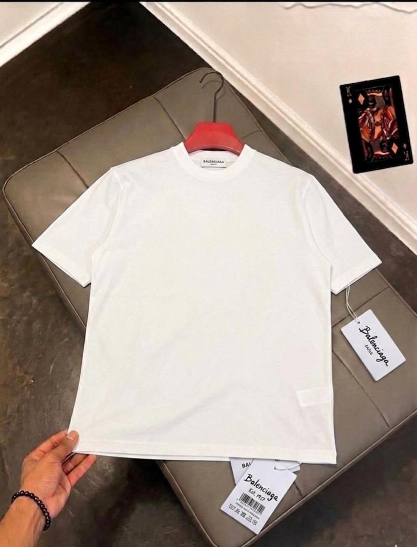 White Balenciaga plain t-shirt on red hanger with visible neck label and attached tags.
