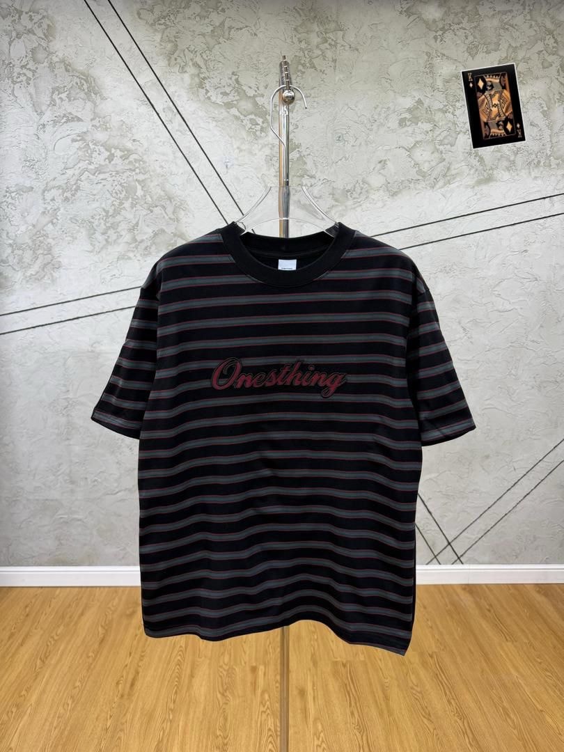 Black striped Onesthing embroidered t-shirt on hanger, front view.