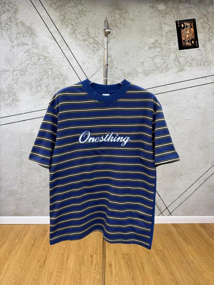 Blue striped Onesthing embroidered t-shirt on hanger, front view.