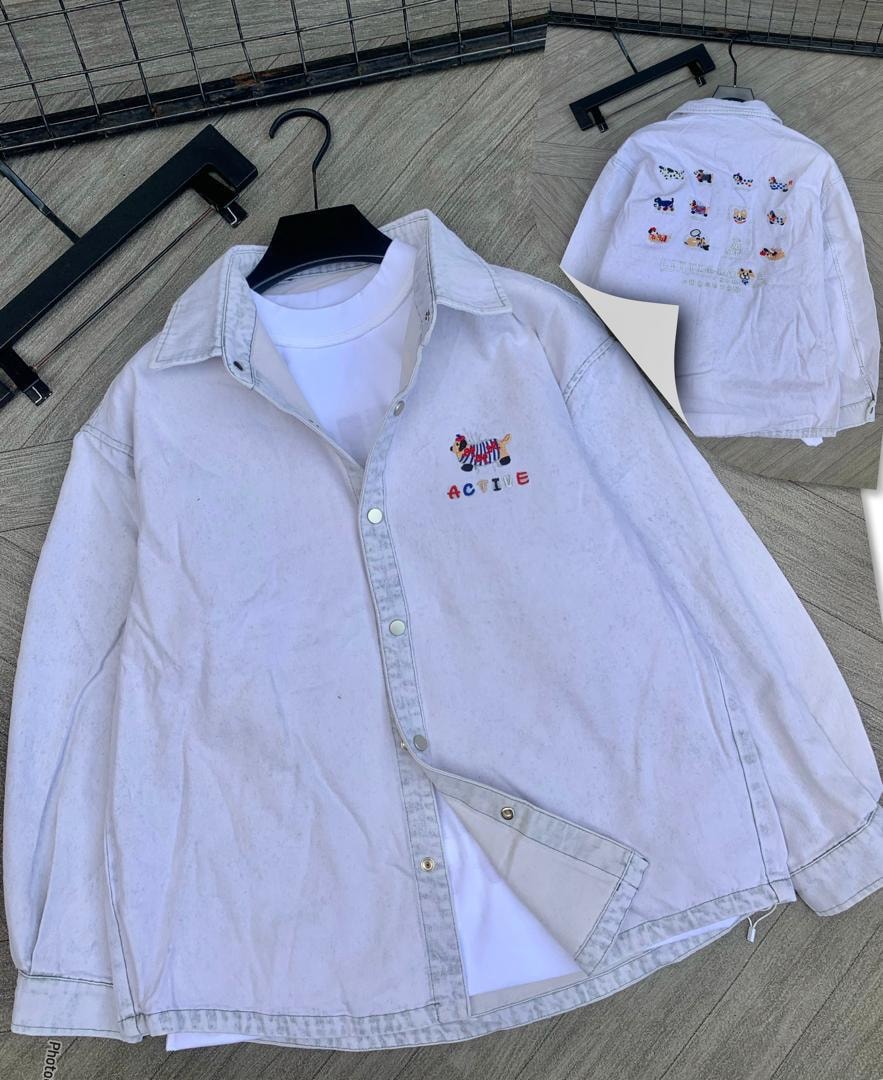White oversized denim jacket with colorful zebra and ACTIVE embroidery on chest plus back view with multiple animal prints.