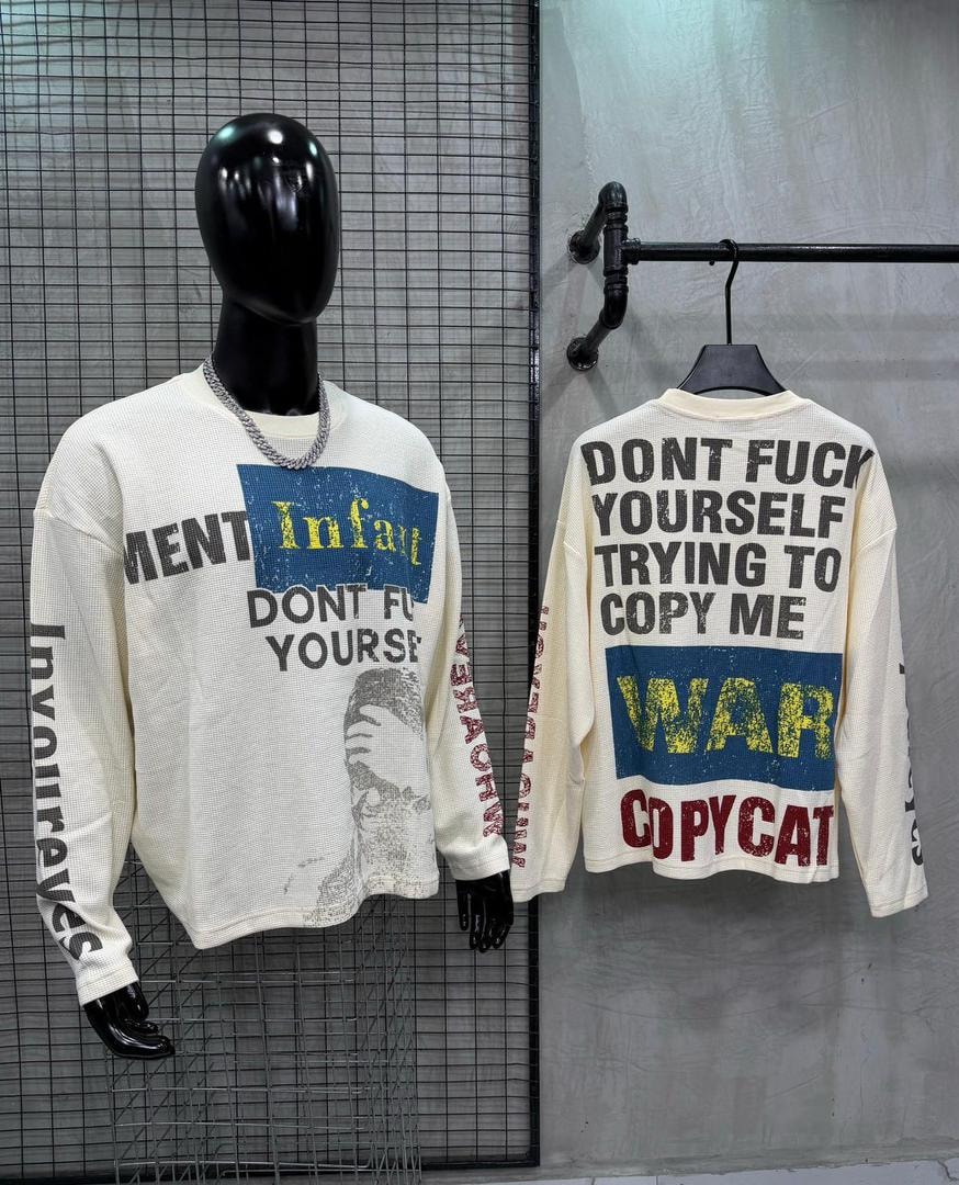 Front view on mannequin and back view of cream graphic long sleeve shirt with text and prints.