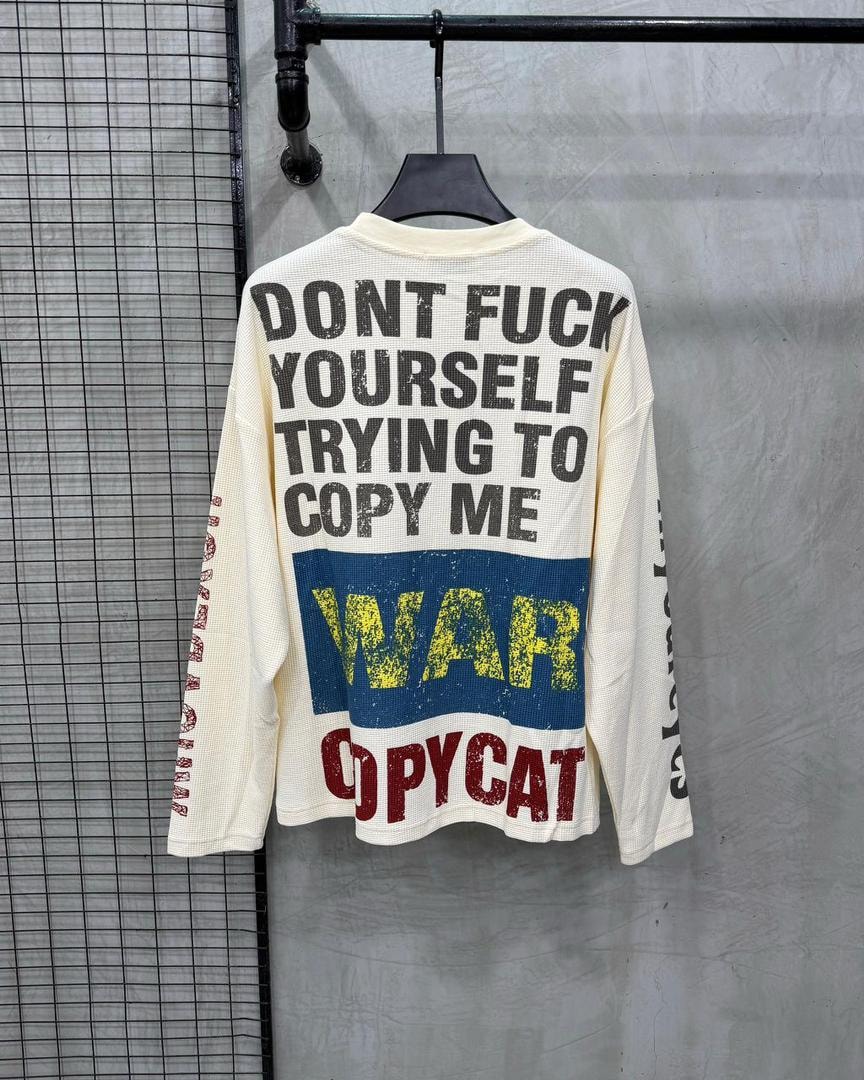 Back view of cream waffle long sleeve top with large Don't Fuck Yourself, War and Copycat prints.