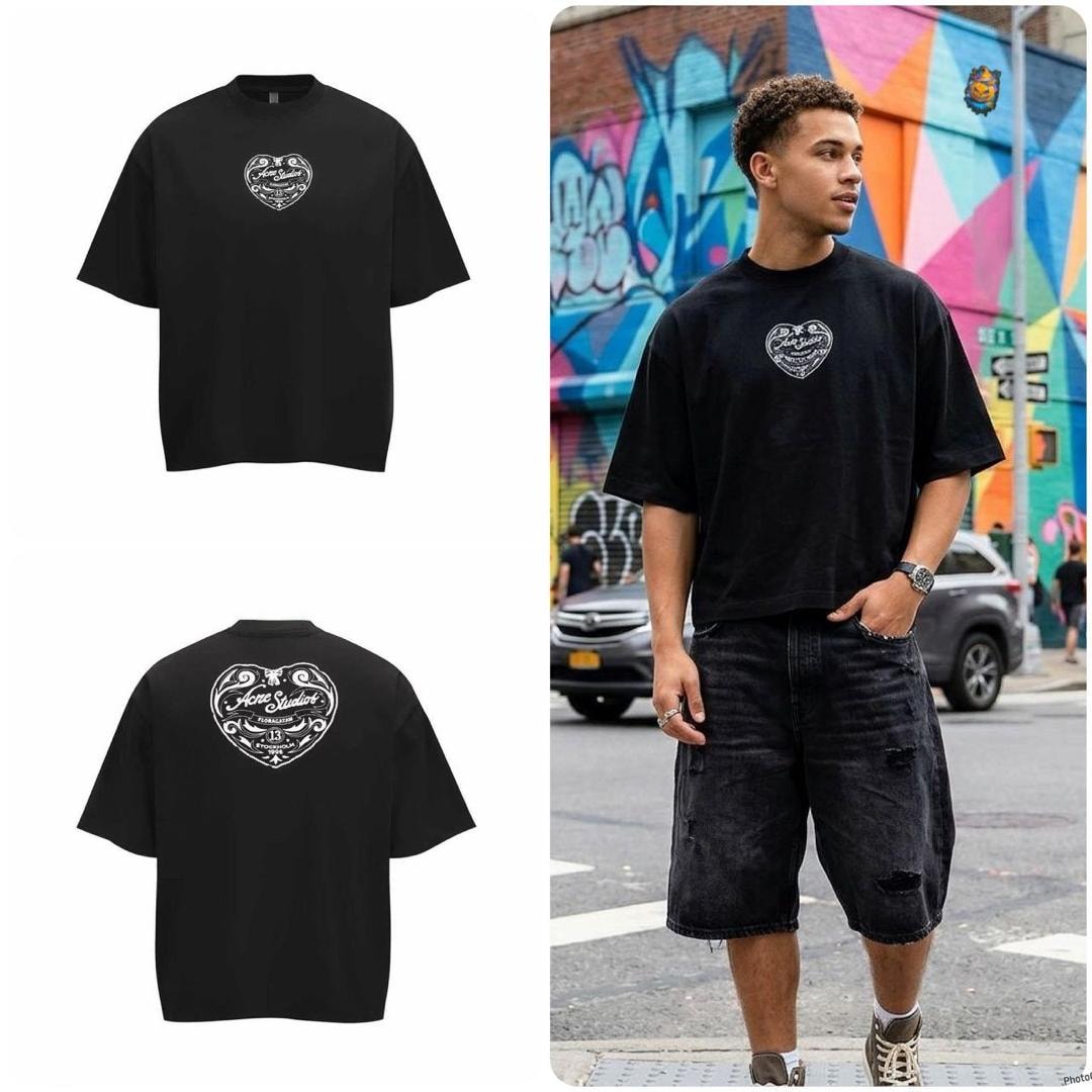Black oversized t-shirt with heart logo on chest and large heart on back, flat and model views.