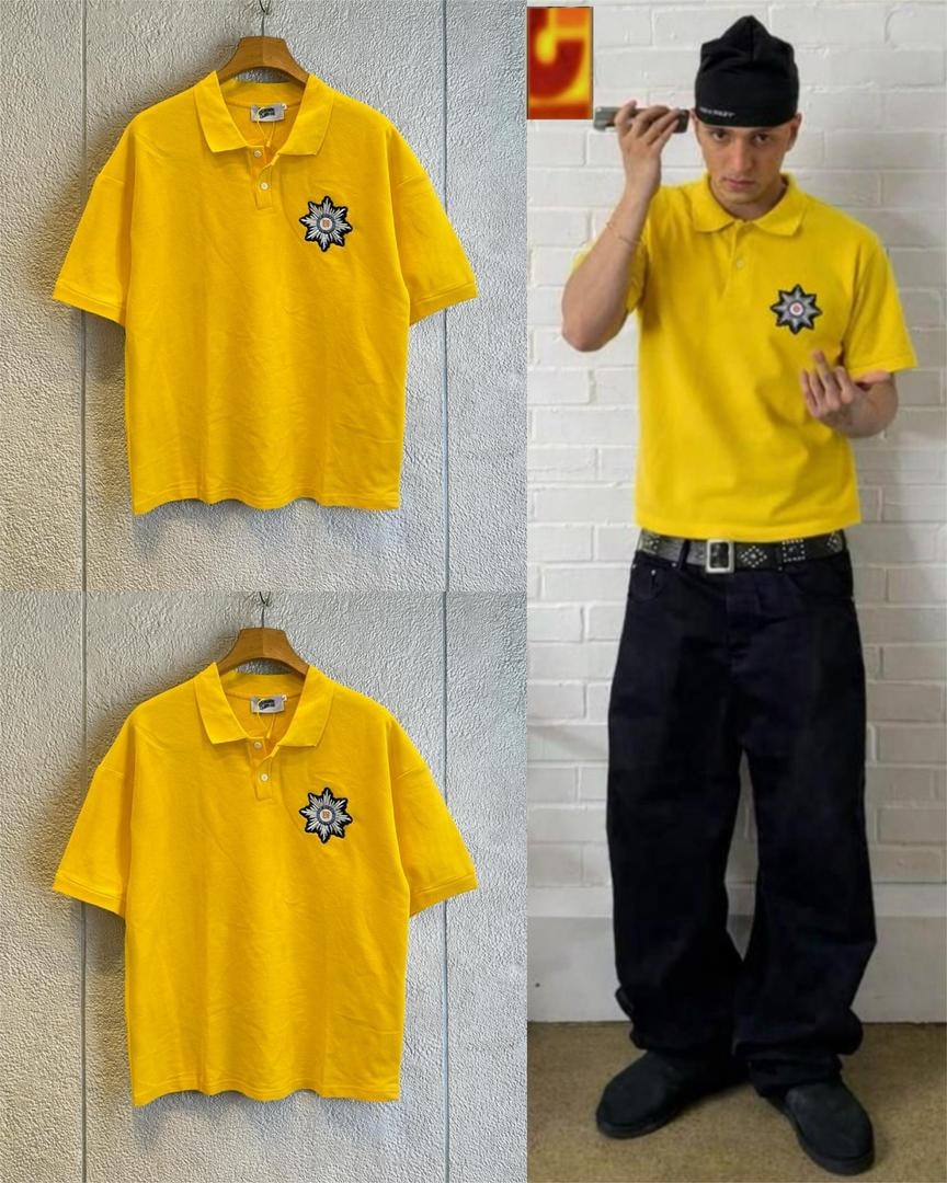Yellow polo shirt with star embroidery shown in flat lay and on a model wearing black pants and a cap.