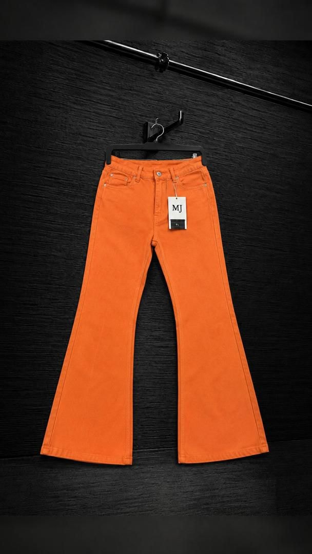 Orange flared jeans with MJ tag displayed on black background.
