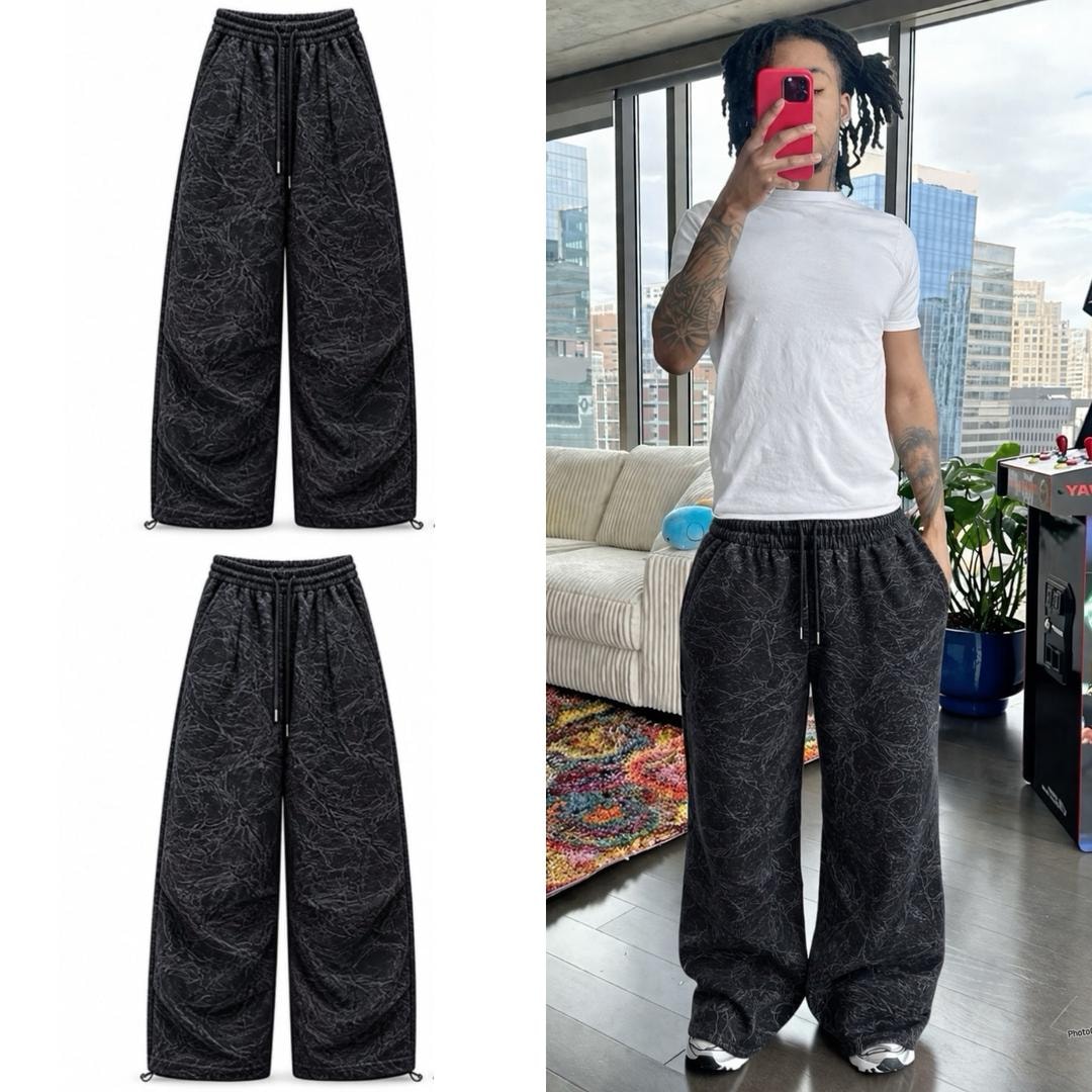 Black patterned wide-leg joggers shown in flat lay and on model wearing with white tee.