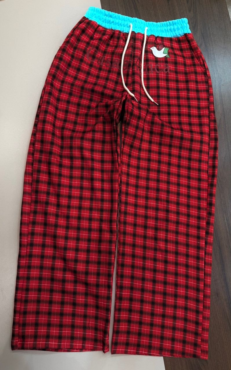 Red and black plaid joggers with Casablanca embroidery, bird logo and turquoise waistband.