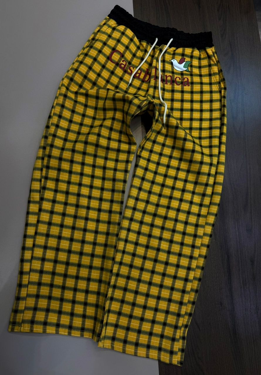 Yellow and black plaid joggers with Casablanca embroidery, bird logo, black waistband and white drawstring.