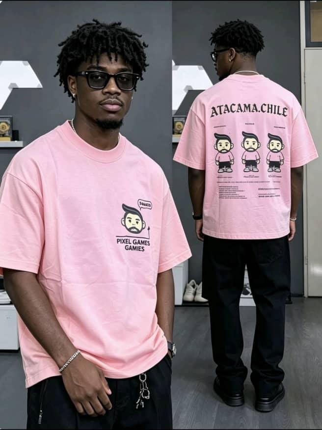 Pink crop t-shirt with pixel games cartoon on chest and detailed back print, shown on model and flat lays.
