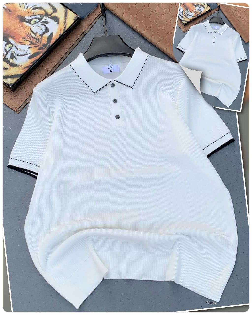 White ribbed polo shirt with black contrast stitching on collar and cuffs, laid flat with inset view.