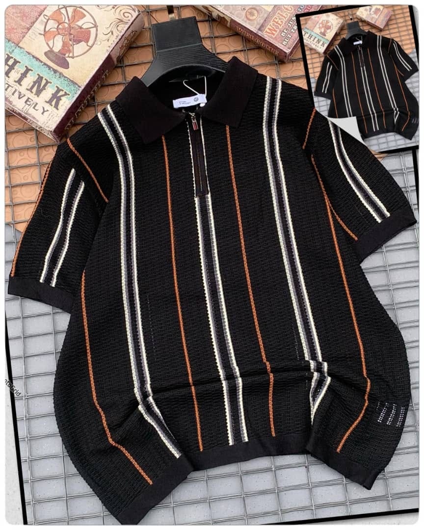 Black striped knitted zip polo shirt on hanger with inset image.
